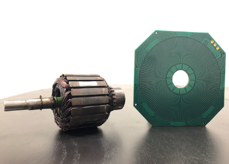PCB Stator next to a traditional copper wound stator 